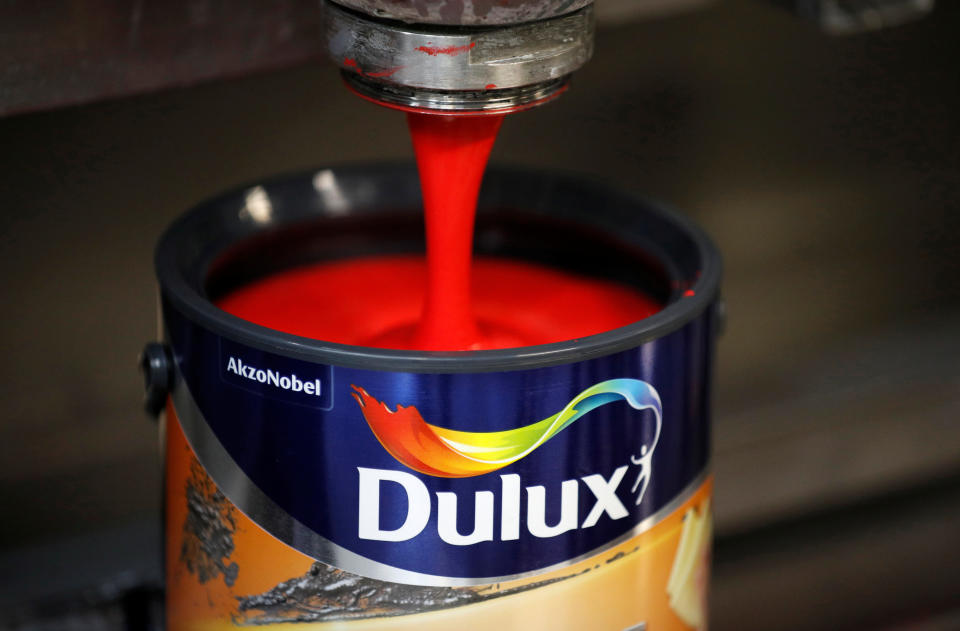 Dulux paint cans are filled on the production line inside AkzoNobel’s new paint factory in Ashington, Britain. (Photo: REUTERS/Phil Noble)