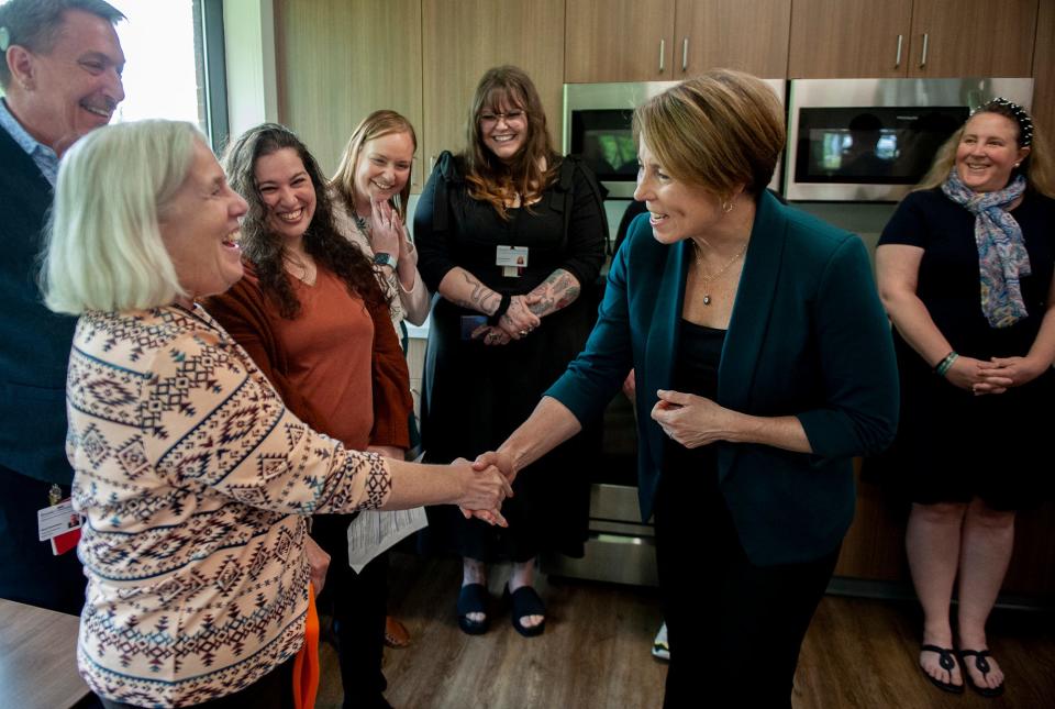  Sandy Felder, of Natick, a psychiatrist at  Riverside Community Behavioral Health Center in Milford, greets Gov. Maura Healey, May 9, 2023. The governor toured the facility and signed a proclamation for Mental Health Awareness Month with state and local officials.