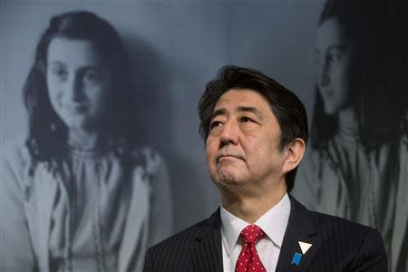 Japan's Prime Minister Shinzo Abe visits the Anne Frank House museum in Amsterdam March 23, 2014. REUTERS/Cris Toala Olivares