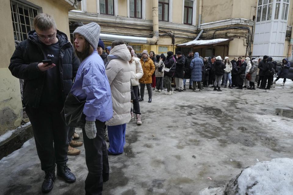 People line up to sign petitions in St. Petersburg, Russia, on Wednesday, Jan. 24, 2024, for Boris Nadezhdin, a liberal Russian politician who Is seeking to run for president in the March 17 election. Supporters lined up not just in progressive cities like Moscow and St. Petersburg but also in Krasnodar in the south, Saratov and Voronezh in the southwest and beyond the Ural Mountains in Yekaterinburg. There also were queues in the Far East city of Yakutsk, 450 kilometers (280 miles) south of the Arctic Circle, where Nadezhdin's team said up to 400 people a day braved temperatures that plunged to about minus 40 Celsius (minus 40 Fahrenheit) to sign petitions. (AP Photo/Dmitri Lovetsky)