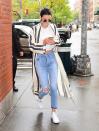 <p>A longline coat and mom jeans are Jenner’s go-to and it looks flawless every single time. [Photo: Getty] </p>