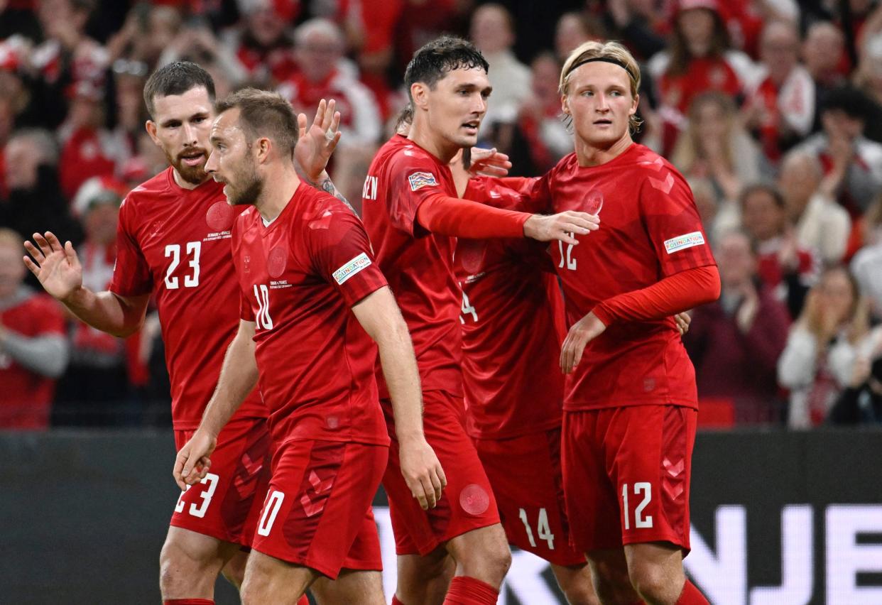 Danish national team players huddle up during a match ahead of the 2022 World Cup.