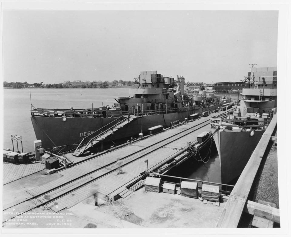 USS Amesbury fits out at the builder's yard at Hingham, Massachusetts on July 6, 1943. A sister ship can be seen at right.