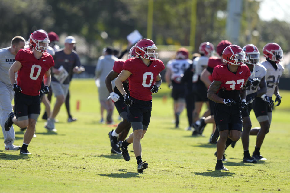 Players run drills as the team prepares for the Orange Bowl NCAA college football game, Wednesday, Dec. 27, 2023, in Miami. Georgia is scheduled to play Florida State in the Orange Bowl Saturday at Hard Rock Stadium in Miami Gardens. (AP Photo/Lynne Sladky)