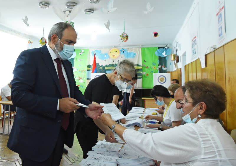 FILE PHOTO: Leader of Civil Contract party Nikol Pashinyan casts his vote during the snap parliamentary election in Yerevan