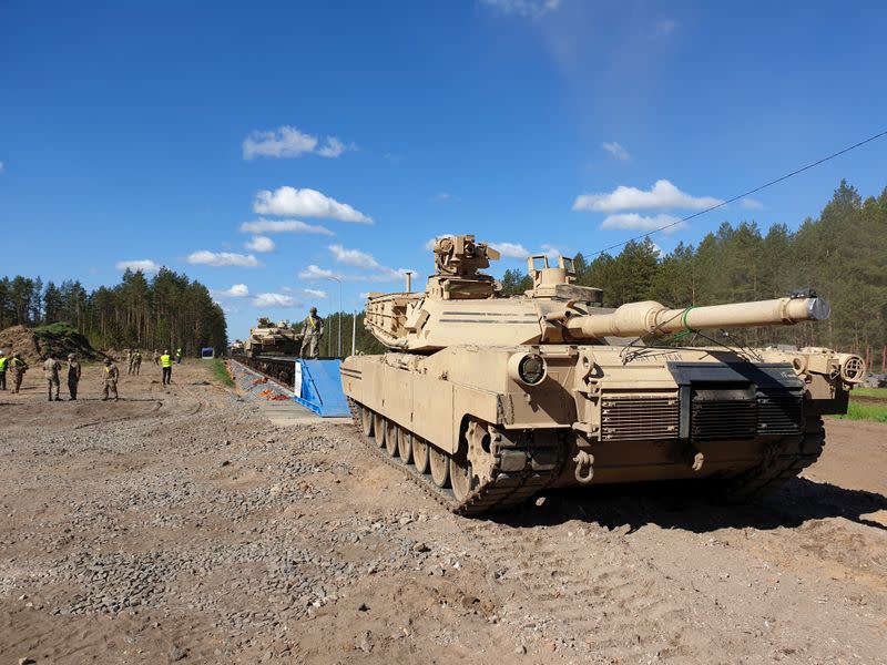 U.S. Abrams tanks are loaded on rail in Pabrade training ground