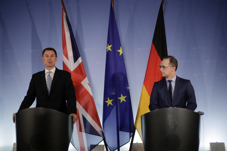 German Foreign Minister Heiko Maas, right, and British Foreign Secretary Jeremy Hunt attend a joint news conference after a meeting at the foreign ministry in Berlin, Wednesday, Feb. 20, 2019. (AP Photo/Markus Schreiber)