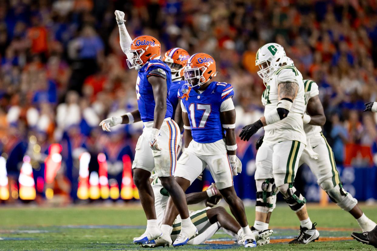 Florida Gators linebacker Shemar James (6) celebrates with Florida Gators linebacker Scooby Williams (17) after a sack during the first half against the Charlotte 49ers at Steve Spurrier Field at Ben Hill Griffin Stadium in Gainesville, FL on Saturday, September 23, 2023. [Matt Pendleton/Gainesville Sun]