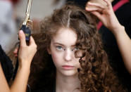 A model has her hair done backstage before Christian Dior's Haute Couture Spring-Summer 2017 live show to celebrate Dior's new flagship store at the Ginza Six mall in Tokyo, Japan, April 19, 2017. REUTERS/Toru Hanai