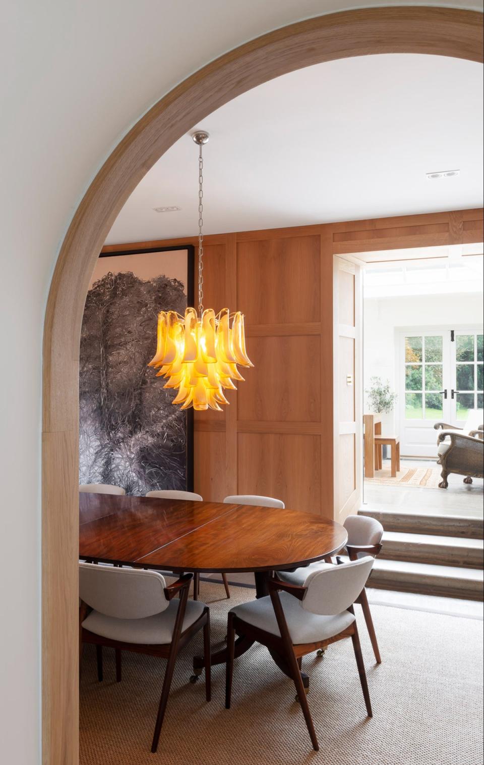 Experts recommend pairing dramatic pendants, such as this one, with statement table lamps (Richard Parr Associates)