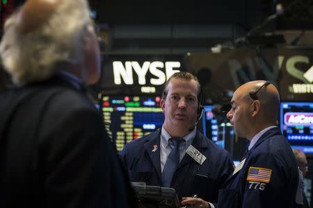 Traders work on the floor of the New York Stock Exchange July 8, 2014. REUTERS/Brendan McDermid