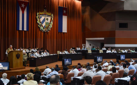 Cuba's President Raul Castro (L, standing at lectern) addresses the audience during an extraordinary session of the National Assembly, in Havana, Cuba June 1, 2017. ACN/Marcelino Vazquez/Handout via REUTERS