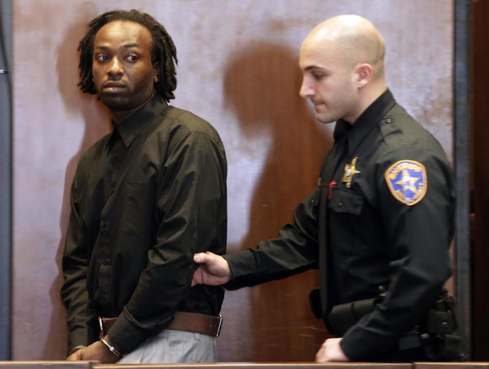 Karif Ford, 31, one of four accused in the Dec. 15, 2013, carjacking at The Mall at Short Hills, where Dustin Friedland, of Hoboken, was fatally shot as he returned with his wife to their vehicle, walks into the courtroom for an arraignment hearing at Essex County Superior Court, Wednesday, Jan. 8, 2014, in Newark, N.J. Hanif Thompson, 29, Basim Henry, 32, and Kevin Roberts, 33, were also charged during the morning arraignment. All four pleaded not guilty. Each has been charged with murder, felony murder, carjacking, conspiracy, possession of a weapon and possession of a weapon for unlawful purpose. (AP Photo/Julio Cortez)