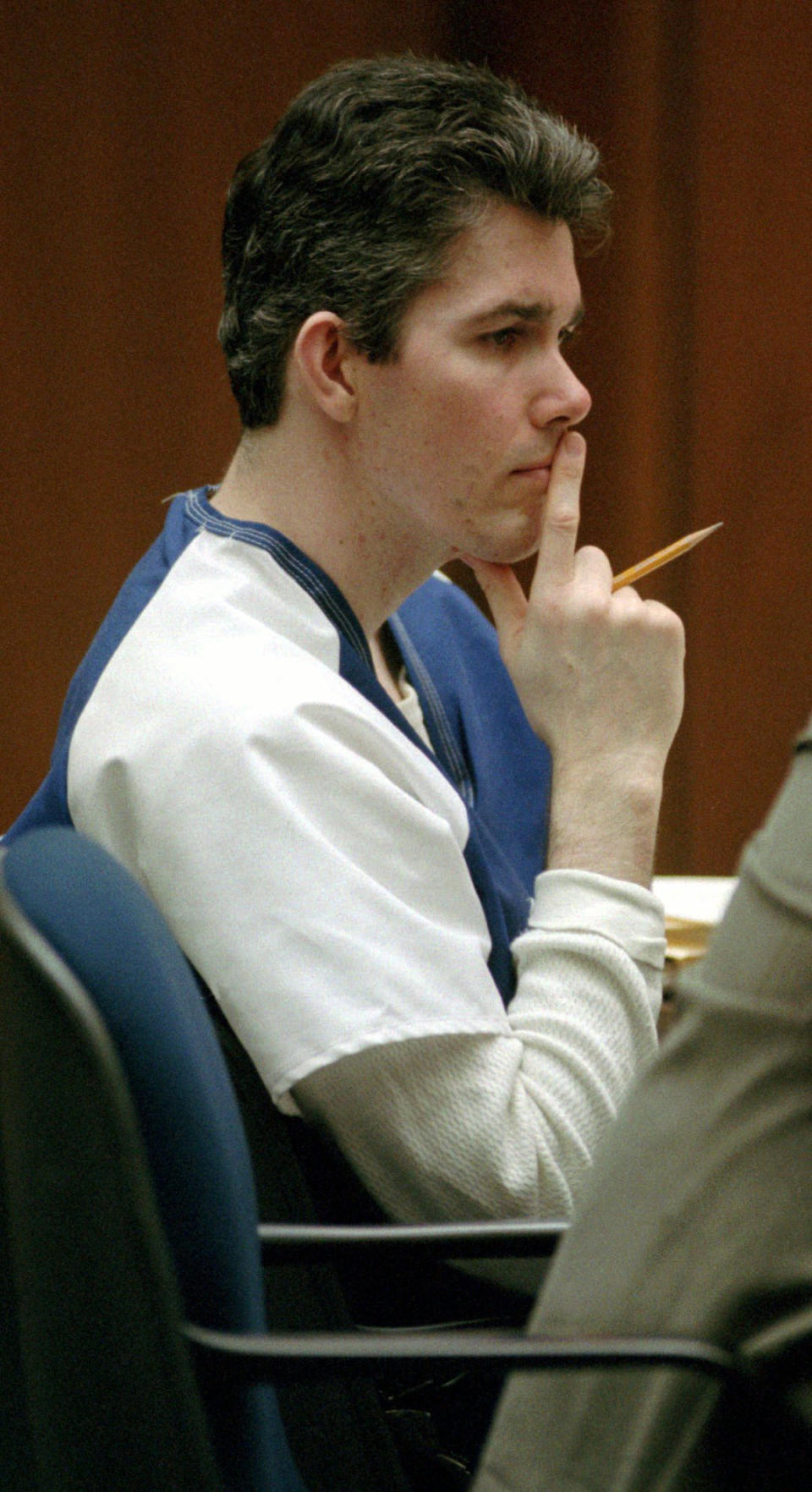 File - In this April 30, 1996, file photo, Joe Hunt, former leader of the Billionaire Boys Club, sits in court in Los Angeles during a habeas corpus hearing. The founder of the infamous Billionaire Boys Club who is serving a life sentence for murder is appealing to California Gov. Jerry Brown for a chance at freedom. (AP Photo/Nick Ut, File)