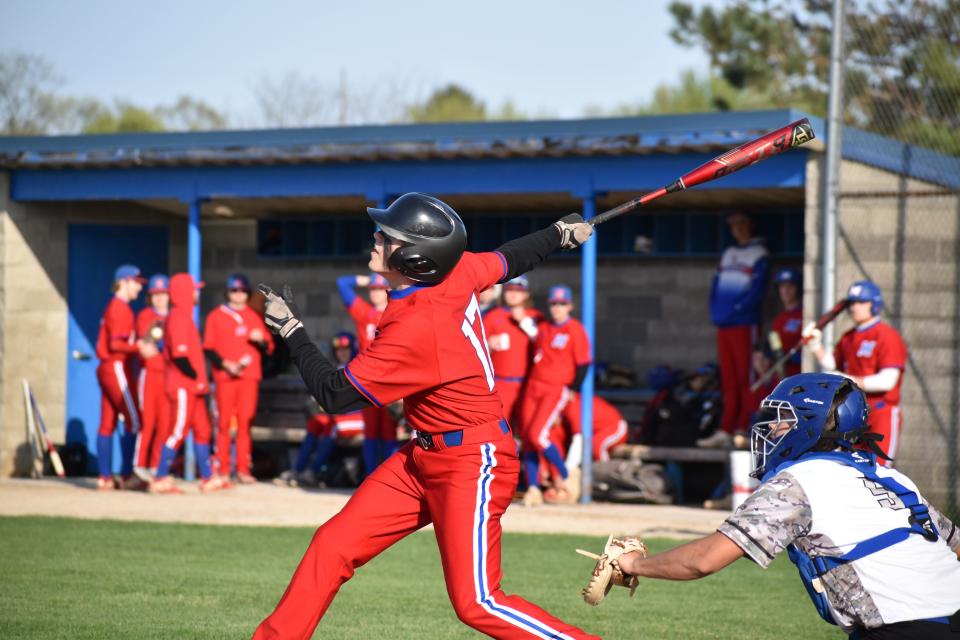 Martinsville's Matt Decker connects on a pitch during the Artesians' Mid-State matchup with Whiteland on April 26, 2022.