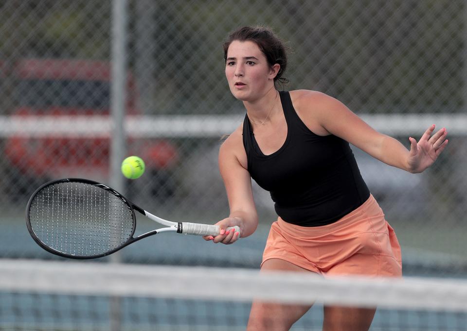 Hoover's Tess Bucher returns a shot against Perry's Kyli Garrett Monday, September 13, 2021