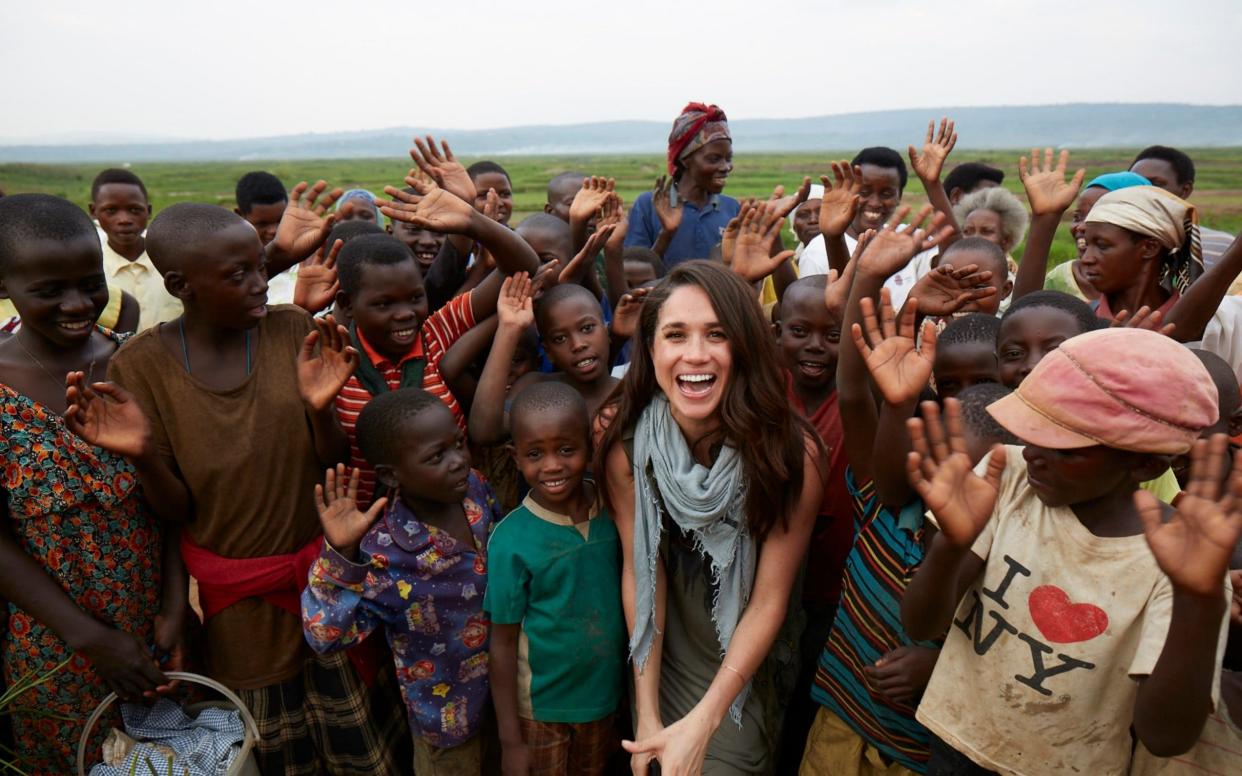 Meghan in Rwanda with charity World Vision in 2017 - PA