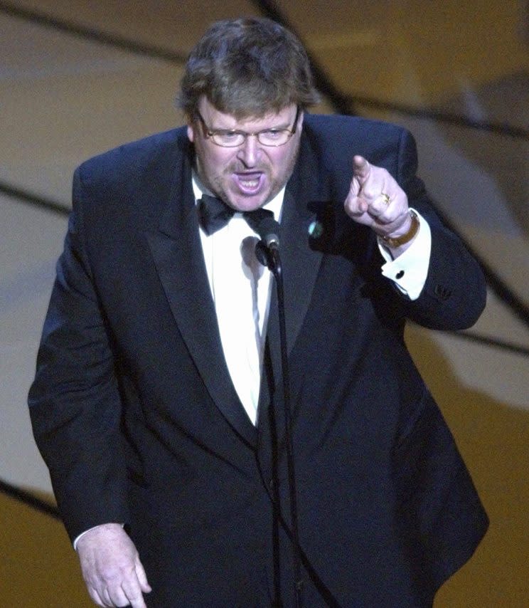 Michael Moore accepting the Oscar for best documentary feature for “Bowling for Columbine” on March 23, 2003 (Photo: Kevork Djansezian/AP)<br>