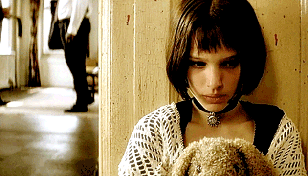 Young Natalie Portman becomes an assassin. (Image: <a href="http://giphy.com/gifs/natalie-portman-queued-leon-DV0psmVytnPcQ" target="_blank">Giphy</a>)