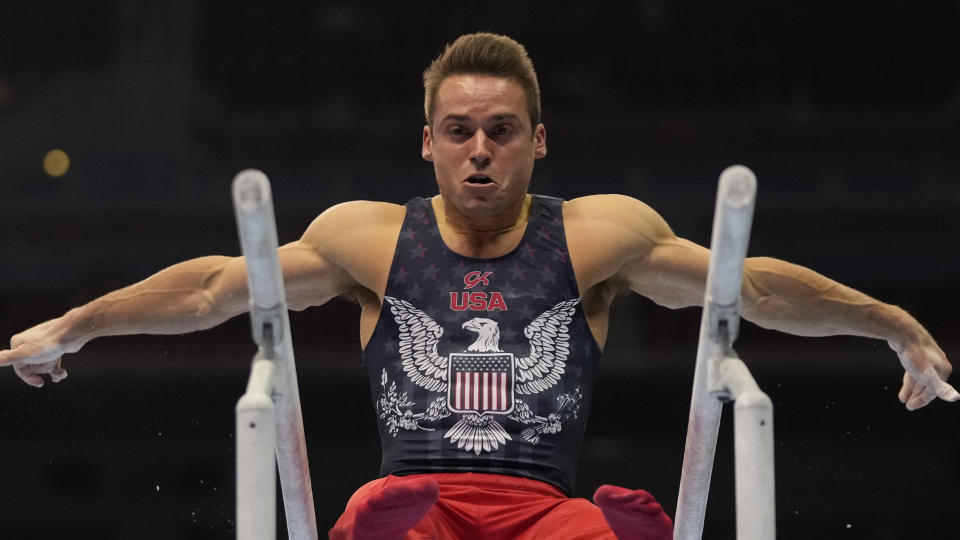 Sam Mikulak competes on the parallel bars during the men's U.S. Olympic Gymnastics Trials Saturday, June 26, 2021, in St. Louis. (AP Photo/Jeff Roberson)