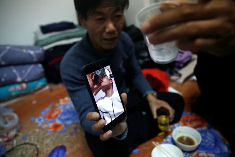 The Wider Image: 'I've let them down': Beijing's migrant workers miss family reunions on Lunar New Year