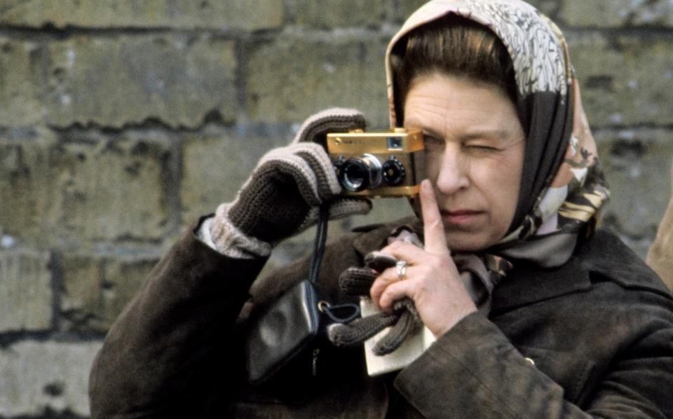 The late Queen with her gold Rollei camera at the Badminton Horse Trials in April 1974. Elizabeth II was part of a long line of keen photographers in the royal family, from Lords Lichfield and Snowdon to Charles, Andrew and the Princess of Wales