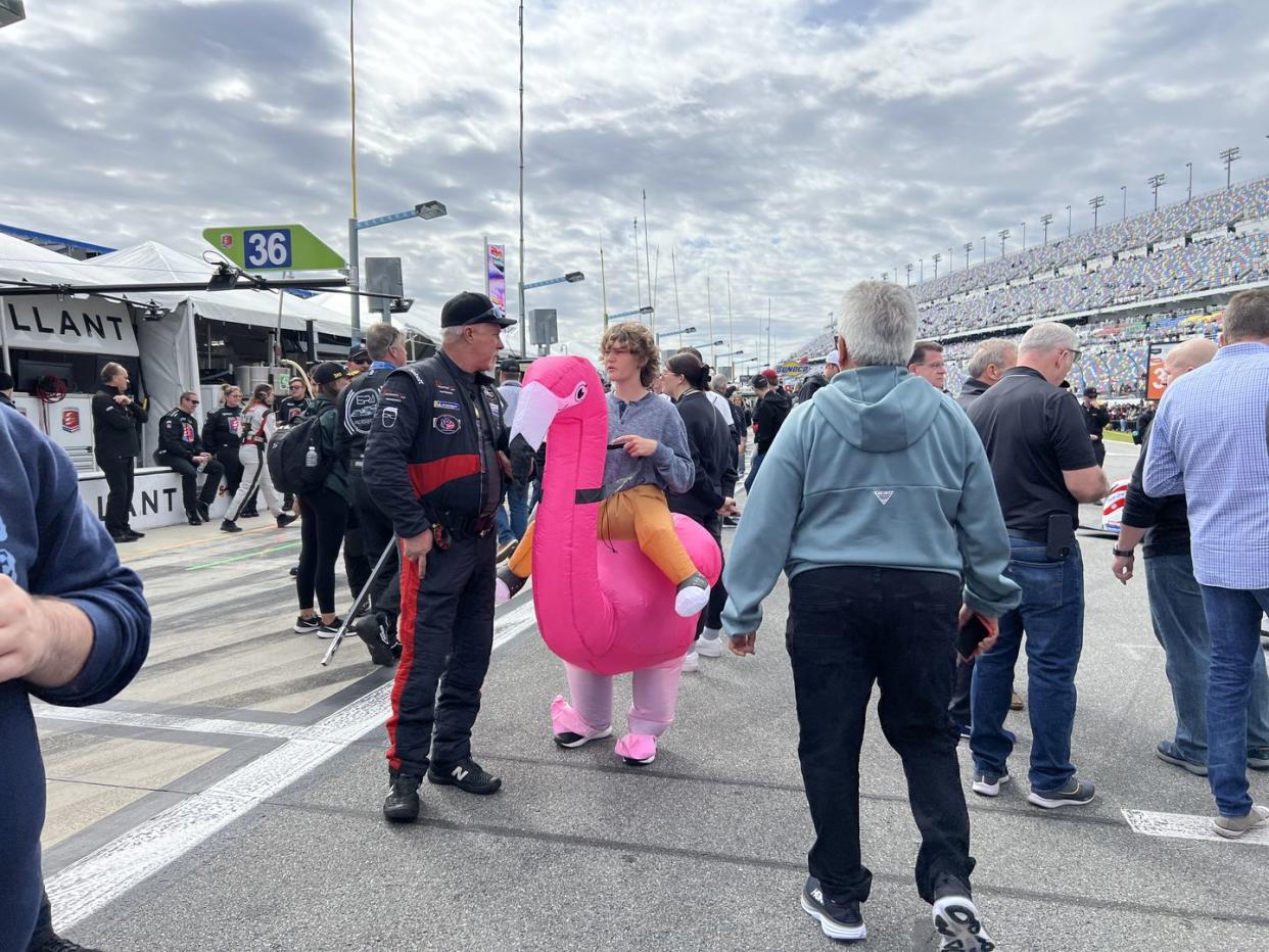 someone in an inflatable flamingo costume at the 24 hours of daytona