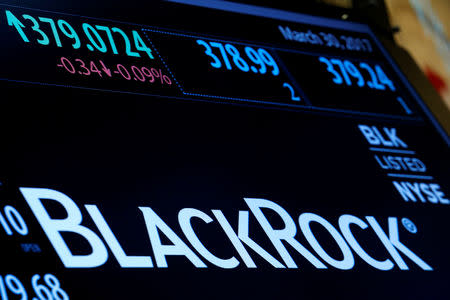 FILE PHOTO: The company logo and trading information for BlackRock is displayed on a screen on the floor of the New York Stock Exchange (NYSE) in New York, U.S., March 30, 2017. REUTERS/Brendan McDermid