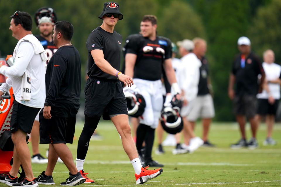 Cincinnati Bengals quarterback Joe Burrow (9) walks between drills as he observes during a joint practice between the Green Bay Packers and the Cincinnati Bengals, Wednesday, Aug. 9, 2023, at the practice fields next to Paycor Stadium in Cincinnati.