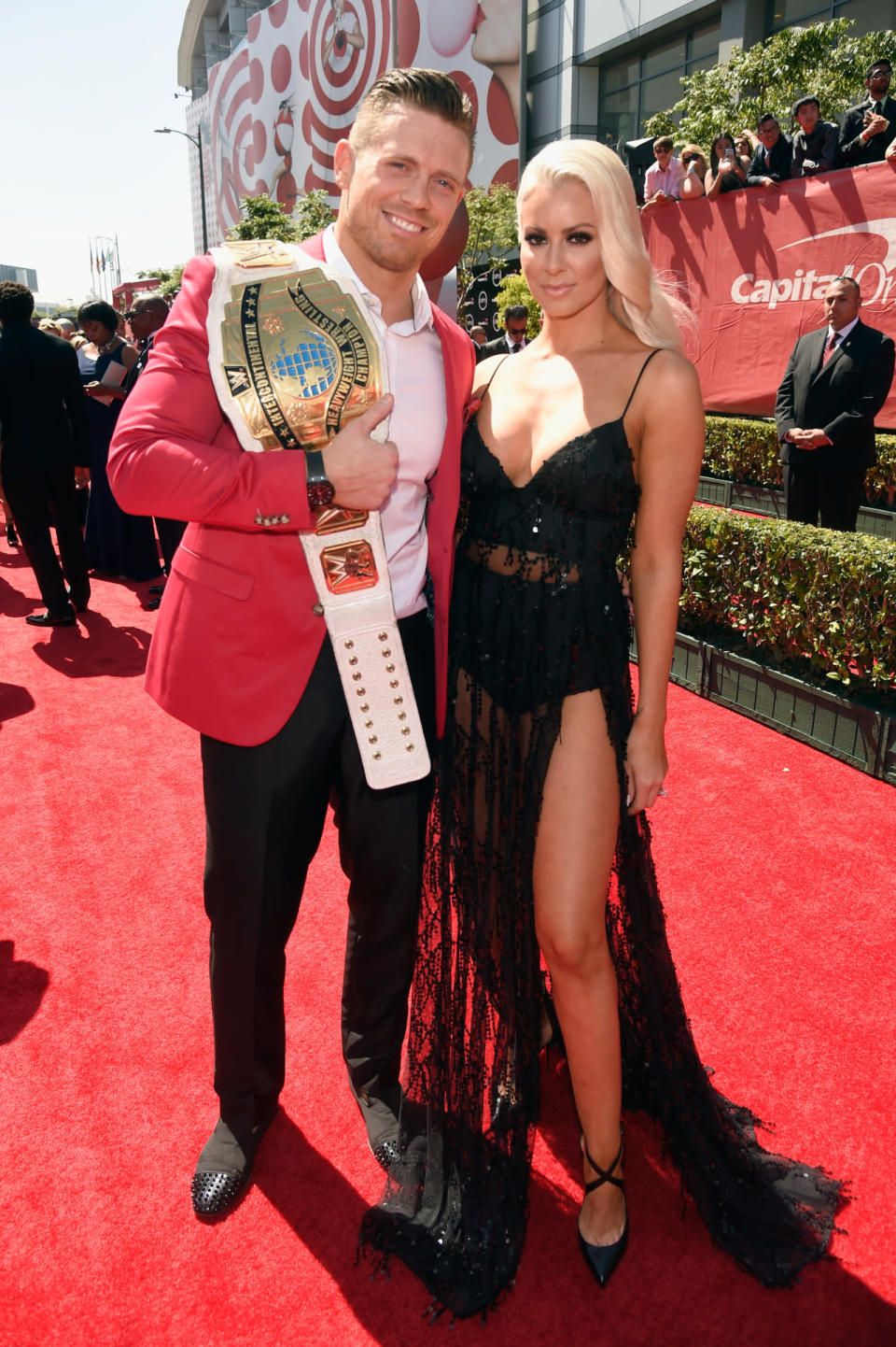 Professional wrestler the Miz accessorized his suit with his winners’s belt, with Maryse Ouellet in a black lace dress