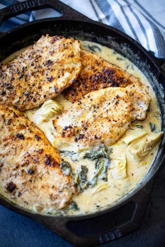 <p>Butter be Ready</p><p>This one-pan creamy spinach artichoke chicken is insanely good to the last bite. Extra juicy, succulent and flavorful chicken pan-seared and combined with a deliciously tasty spinach artichoke sauce. Makes a perfect meal for weeknights and more!</p><p><strong>Get the Recipe: </strong><a href="https://www.butterbeready.com/creamy-spinach-artichoke-chicken/" rel="nofollow noopener" target="_blank" data-ylk="slk:Creamy Spinach Artichoke Chicken;elm:context_link;itc:0;sec:content-canvas" class="link rapid-noclick-resp"><strong>Creamy Spinach Artichoke Chicken</strong></a></p>