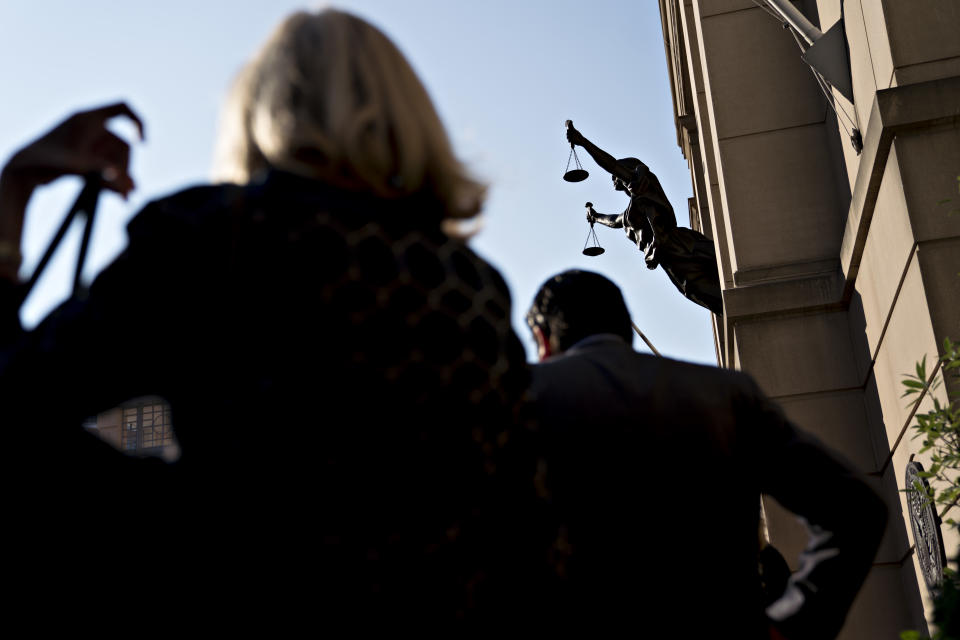 <p>People stand in line to enter District Court in Alexandria, Va., on Wednesday, Aug. 15, 2018. (Photo: Andrew Harrer/Bloomberg via Getty Images) </p>