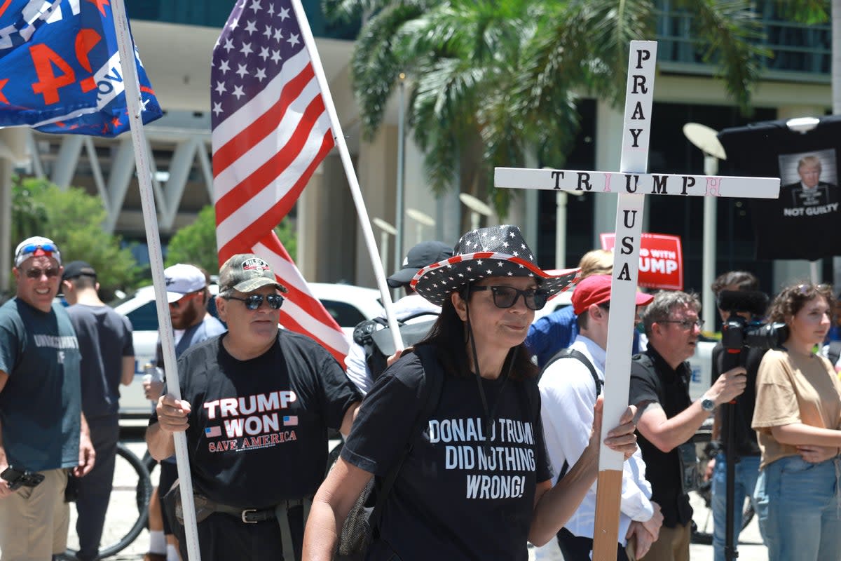 Donald Trump’s supporters gathered outside federal court on 13 June as the former president was booked on 37 charges stemming from an investigation in to his possession of classified documents at Mar-a-Lago. (Getty Images)