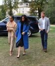 <p>On September 20, the Duchess of Sussex was joined by her mother Doria Ragland and Prince Harry to celebrate the launch of her new cookbook. For the Kensington Palace event, the royal dressed in a cobalt blue Smyth coat, Tuxe body and a pleated skirt by Misha Nonoo. To accessorise the outfit, the Duchess added a pair of Sarah Flint heels. <em>[Photo: Getty]</em> </p>