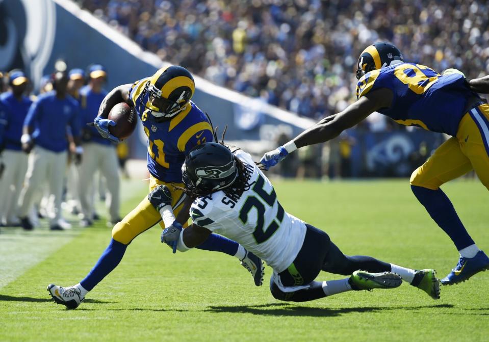 Rams receiver Tavon Austin (11) is forced out of bounds by Seattle cornerback Richard Sherman (25) in 2016.