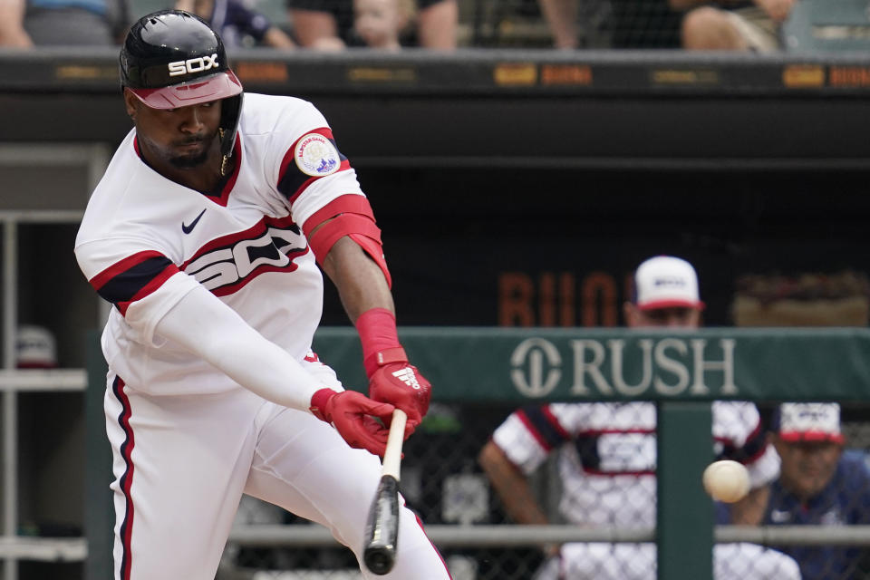 Chicago White Sox's Eloy Jimenez hits a single against the Detroit Tigers during the first inning of a baseball game in Chicago, Sunday, Aug. 14, 2022. (AP Photo/Nam Y. Huh)