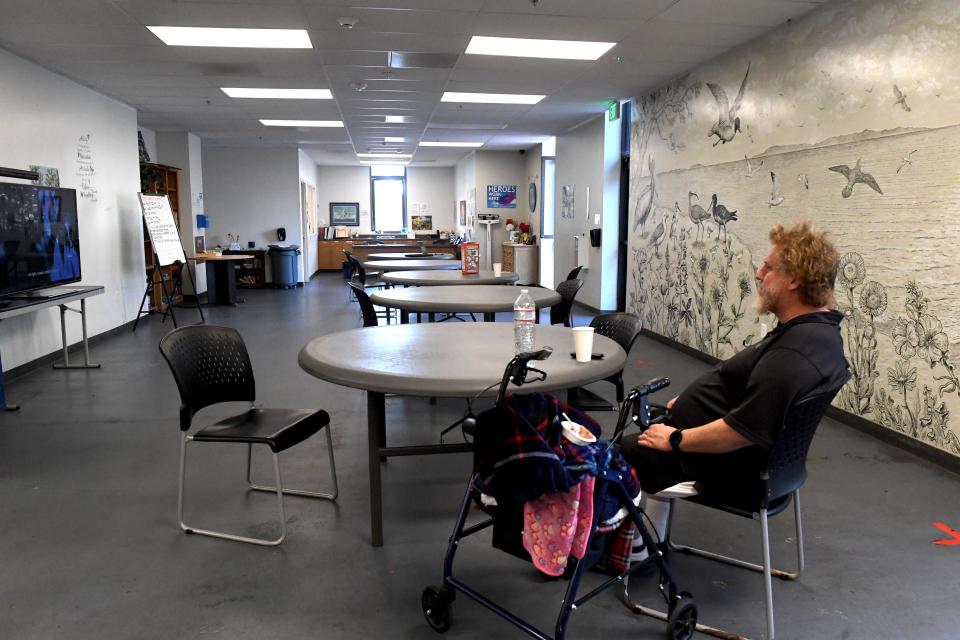 Ryan Schatz, 48, watches television in the dining area at The ARCH, a Ventura shelter run by Mercy House, in May.