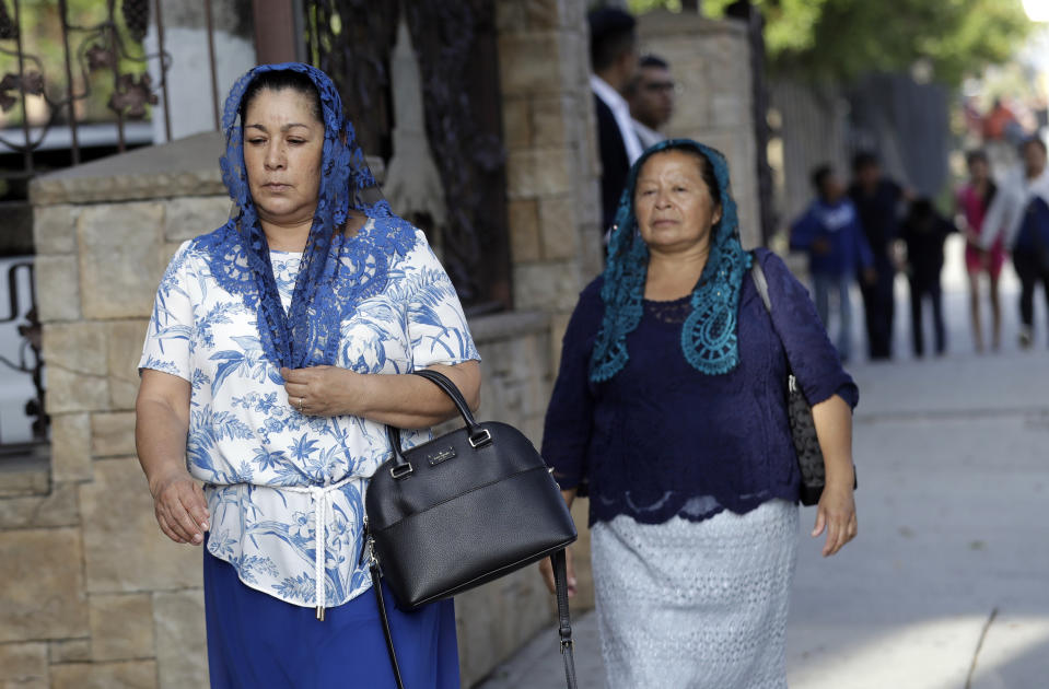 Worshipers arrive for a service at a La Luz del Mundo church branch Thursday, June 6, 2019, in Los Angeles. California's top prosecutor said Thursday that he believes there are more victims of child sex abuse than those listed in charges against the leader of Mexico-based megachurch La Luz del Mundo and several followers. (AP Photo/Marcio Jose Sanchez)