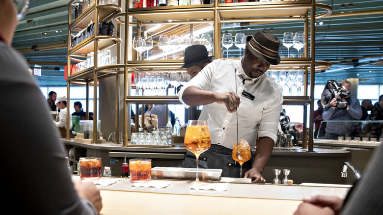 Starbucks bartender stirring drink