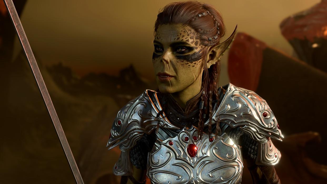  Lae'zel talking to the player while holding her sword up in Baldur's Gate 3. 