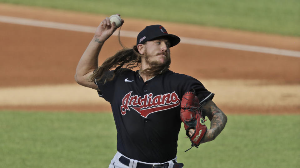 Cleveland Indians starting pitcher Mike Clevinger delivers in the first inning during a preseason baseball game against the Pittsburgh Pirates, Monday, July 20, 2020, in Cleveland. (AP Photo/Tony Dejak)