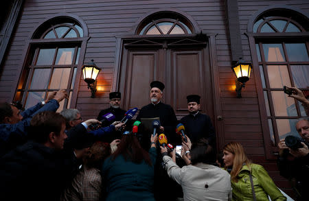 Metropolitan Emmanuel of France reads a statement after the Synod meeting at the Ecumenical Orthodox Patriarchate in Istanbul, Turkey October 11, 2018. REUTERS/Murad Sezer