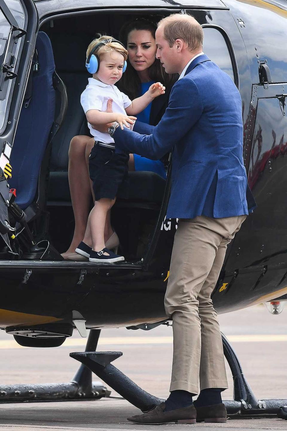 Catherine, Duchess of Cambridge, Prince George of Cambridge and Prince William, Duke of Cambridge sit in a helicopter as they attend the The Royal International Air Tattoo at RAF Fairford on July 8, 2016 in Fairford, England.