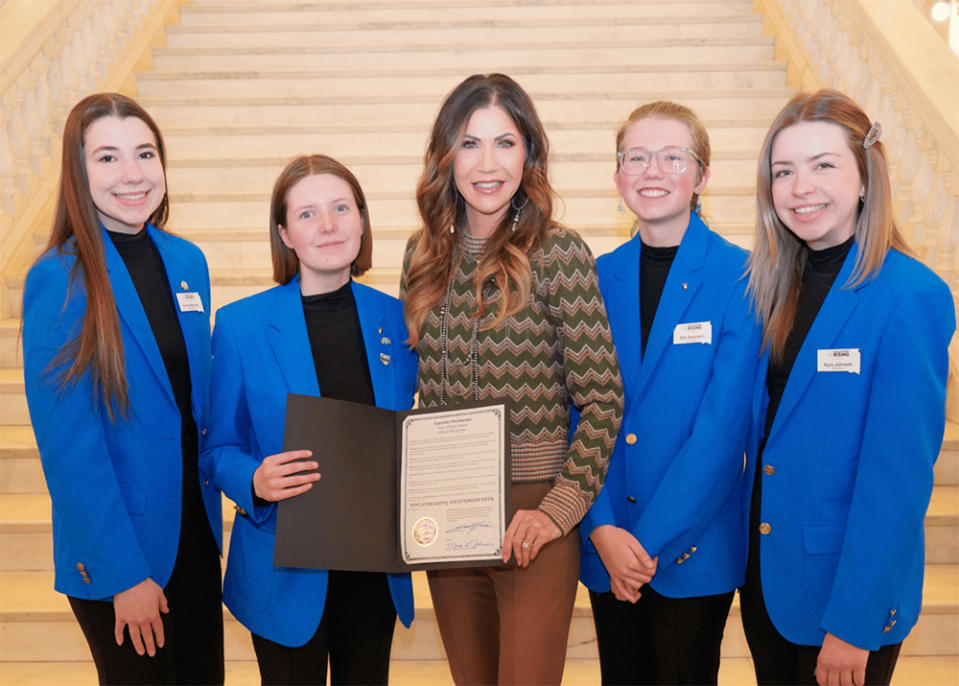 Educators Rising SD state officers pose for a photo with Gov. Kristi Noem. (Educators Rising SD)