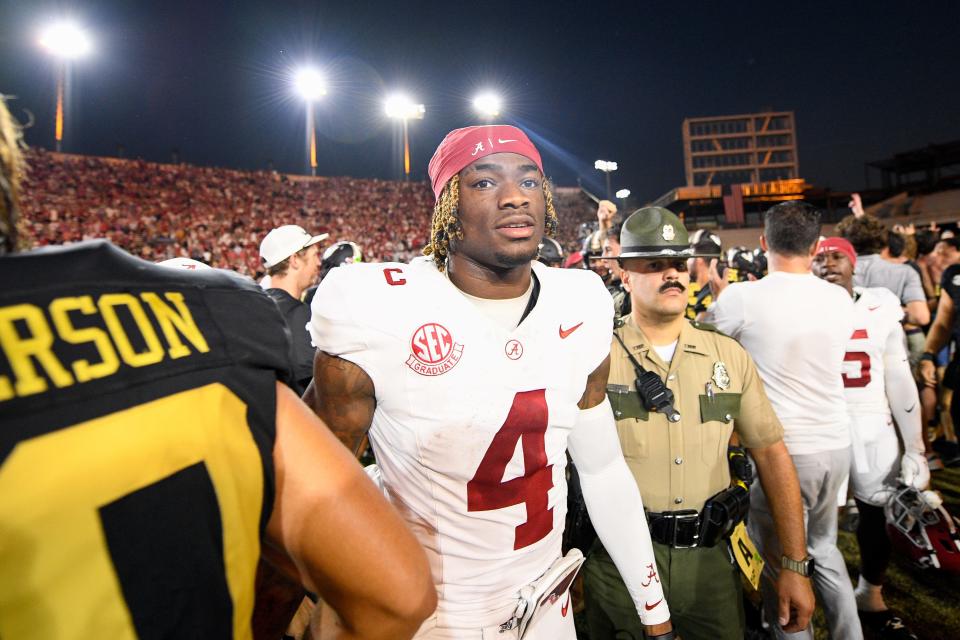 Alabama quarterback Jalen Milroe (4) shakes hands with Vanderbilt players after his team's loss at FirstBank Stadium.