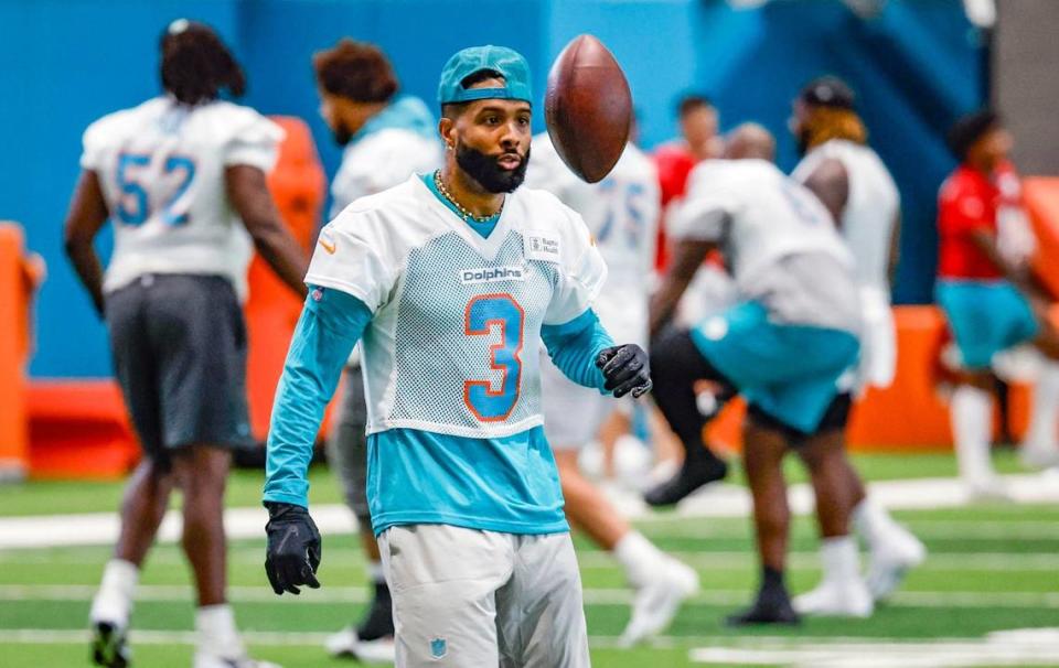 Miami Dolphins wide receiver Odell Beckham Jr. (3) tosses a football during practice at the Baptist Health Training Complex in Miami Gardens, Florida on Wednesday, June 5, 2024.