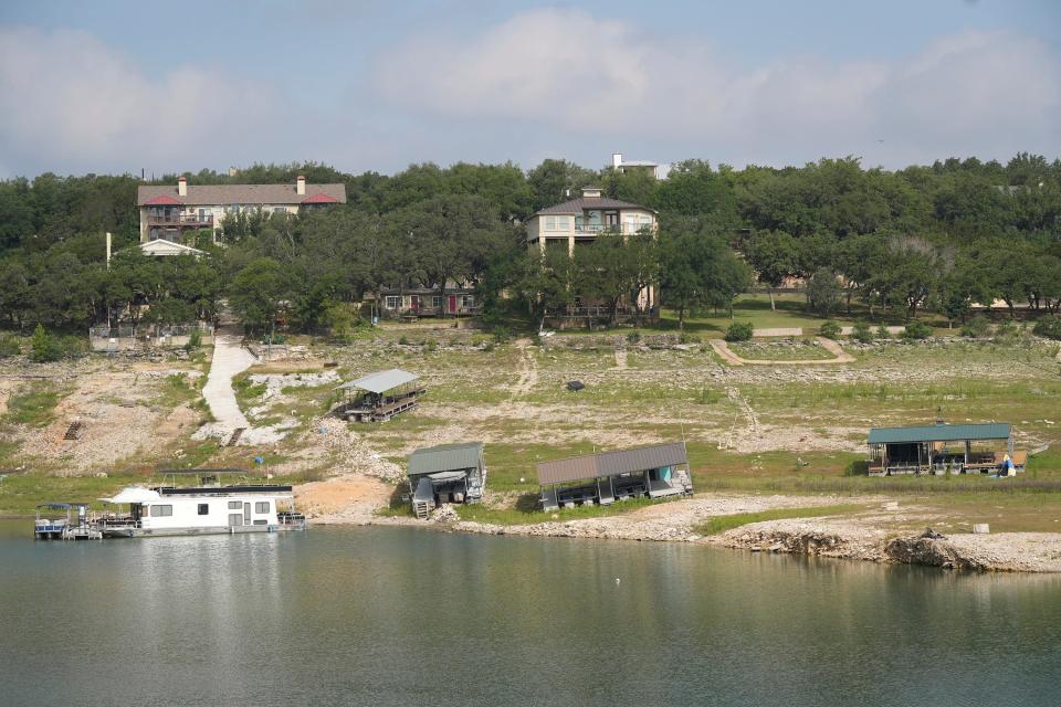 Boat docks are stranded on dry ground at Lake Travis late last month. Lake Travis currently is about 48 feet below its normal level.