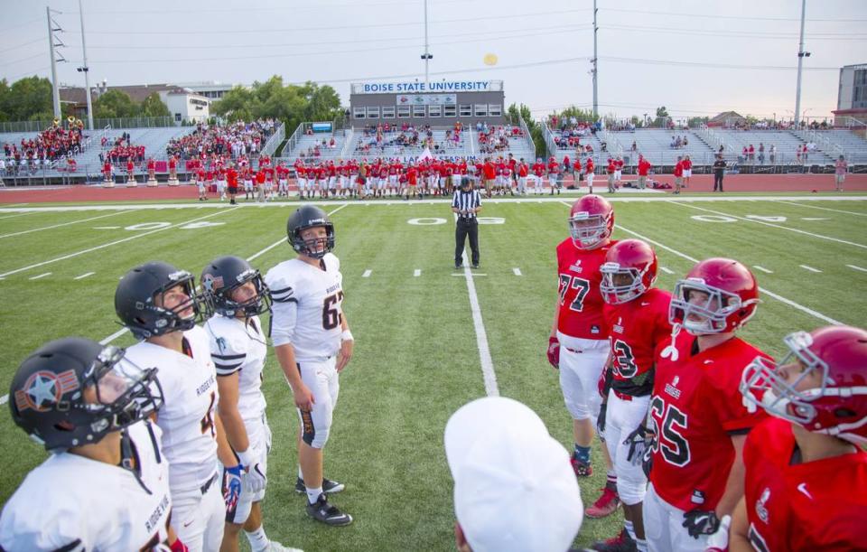 Boise’s four high schools share Dona Larsen Park in Downtown Boise for their varsity football games. Above, the pregame coin toss kicks off a 2017 game between Boise and Ridgevue. Kyle Green/Idaho Statesman file