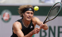 Germany's Alexander Zverev plays a return to Russia's Roman Safiullin during their second round match on day four of the French Open tennis tournament at Roland Garros in Paris, France, Wednesday, June 2, 2021. (AP Photo/Michel Euler)