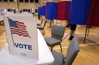 Voters cast their ballots, Tuesday, Sept. 13, 2022, at a polling station in Derry, N.H. (AP Photo/Charles Krupa)